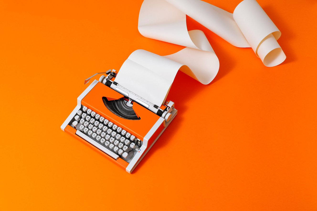 Orange 70s Typewriter on orange Background